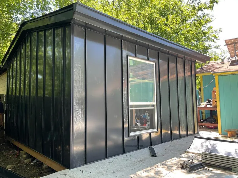 Black standing seam metal wall panels for Metal Roof Installation in Fruita