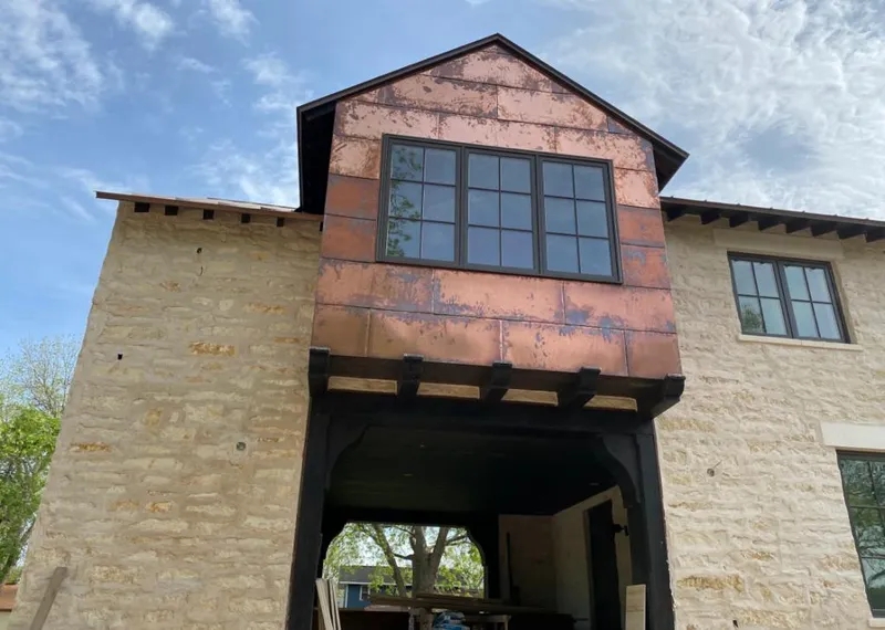 Copper metal panel facade on a stone building for Metal Roof Coating in Fruita