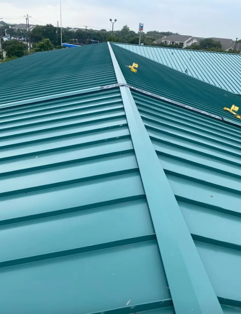 Green commercial metal roof ridge and valley for Metal Roof Repair in Fruita